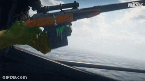 A Person Holding A Rifle With The Word Warzone On The Bottom GIF