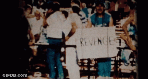 A Person Holding A Sign That Says Revenge 7 GIF