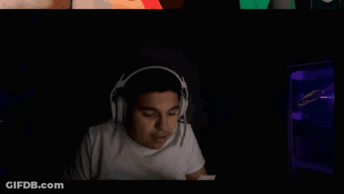 A Person Holding A Stack Of 100 Dollar Bills In Their Hand GIF