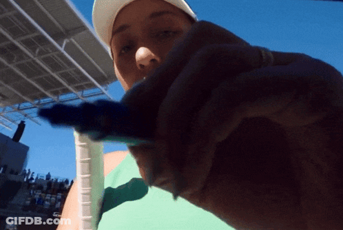 A Person Holding A Tennis Racquet With A Rubber Grip On It GIF