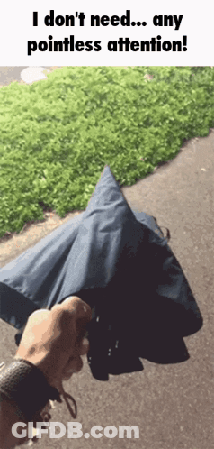 A Person Holding An Umbrella With The Words I Do N't Need Any Pointless Attention GIF