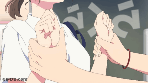 A Person Holding Another Person 'S Arm In Front Of A Sign That Says ' S ' GIF