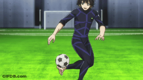 A Person In A Black Suit Kicking A Soccer Ball On A Field GIF