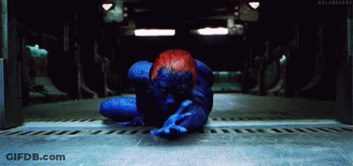 A Person In A Blue And Red Superhero Costume Is Laying On The Floor . GIF
