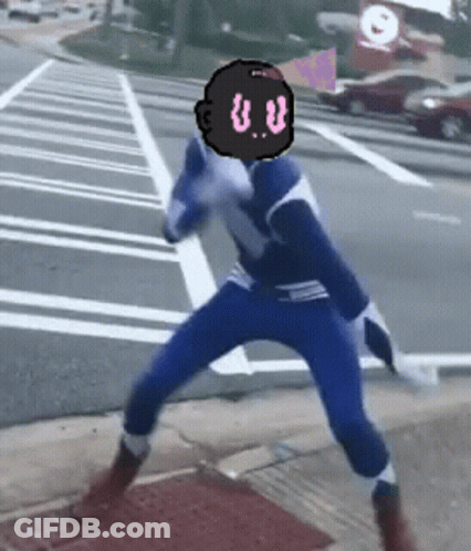 A Person In A Blue And White Superhero Costume With A Black Head With The Letter U.v. On It GIF