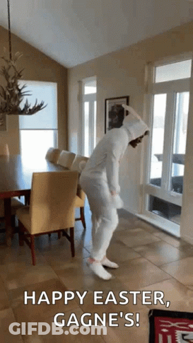 A Person In A Bunny Costume Is Dancing In A Living Room With The Words Happy Easter , Gagne 'S GIF