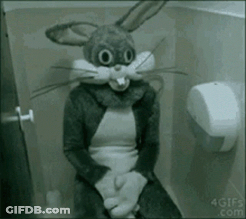 A Person In A Bunny Costume Is Sitting On A Toilet . GIF