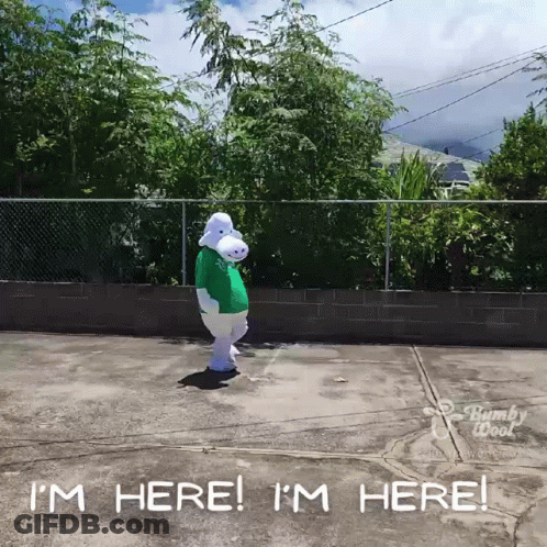 A Person In A Bunny Costume Is Standing In A Parking Lot And Says I 'M Here GIF