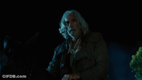 A Person In A Cowboy Hat Is Surrounded By Fire GIF