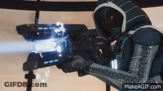 A Person In A Futuristic Suit Is Holding A Gun And Shooting A Laser Beam . GIF