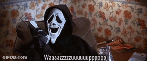 A Person In A Grim Reaper Costume Is Talking On A Phone GIF
