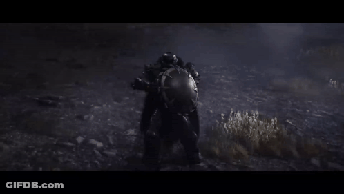 A Person In A Helmet Is Standing In The Dark In A Field . GIF