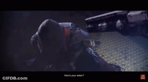 A Person In A Hooded Jacket With Glowing Eyes And The Words " Your Video Source " At The Bottom GIF