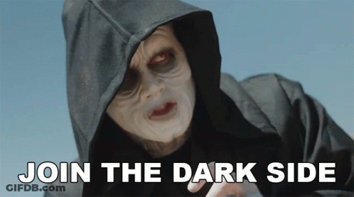 A Person In A Hooded Jacket With The Words Join The Dark Side Below Them GIF