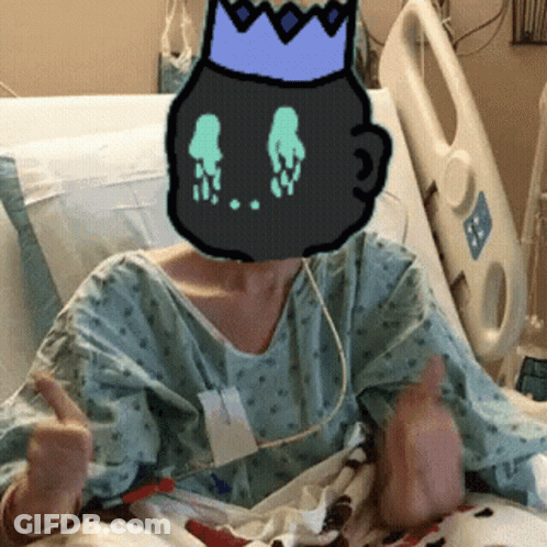 A Person In A Hospital Bed With A Cartoon Character On Their Head GIF