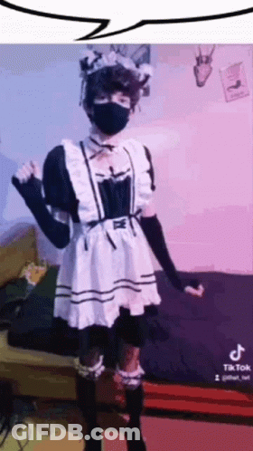 A Person In A Maid Costume Is Wearing A Mask . GIF