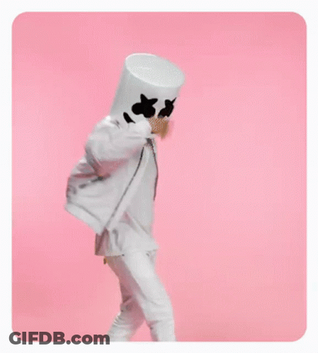 A Person In A Marshmallow Costume Is Standing On A Pink Background . GIF