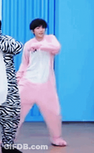 A Person In A Pink Zebra Costume Is Dancing GIF