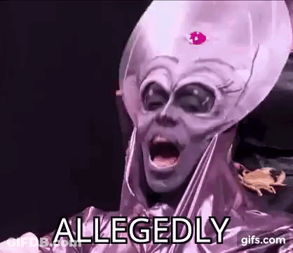A Person In A Purple Alien Costume Is Making A Funny Face . GIF