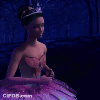 A Person In A Purple Flower Costume Is Crawling On The Ground GIF