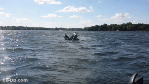 A Person In A Raft Is Floating On A Body Of Water GIF