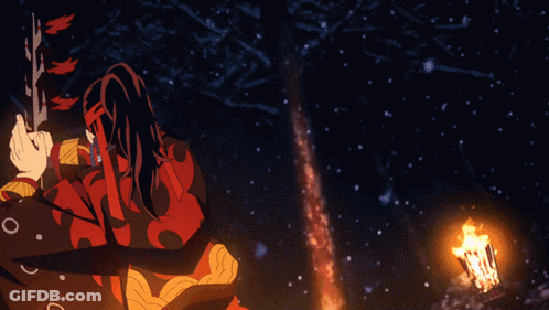 A Person In A Red And Black Outfit With Chinese Writing On Their Face Is Standing In The Snow GIF