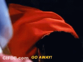 A Person In A Red Cape Says Go Away In Yellow Letters GIF