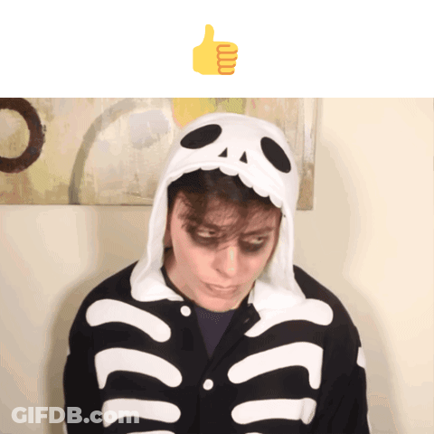 A Person In A Skeleton Costume Giving A Thumbs Up Sign GIF