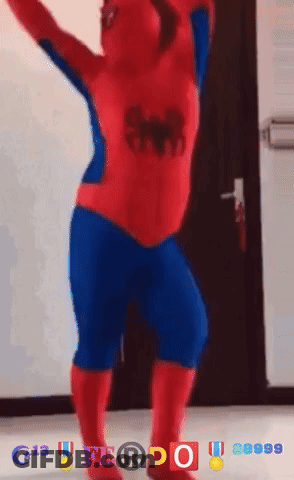 A Person In A Spider Man Costume Is Dancing In Front Of A Door GIF