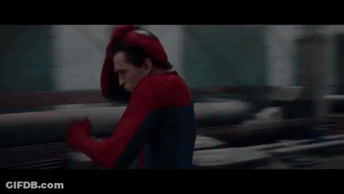 A Person In A Spider-Man Costume Is Running On A Bridge . GIF