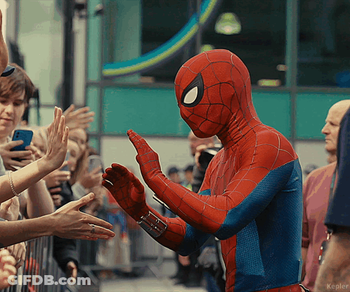 A Person In A Spiderman Costume Giving A High Five GIF