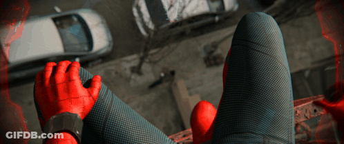 A Person In A Spiderman Costume Is Sitting On A Balcony GIF