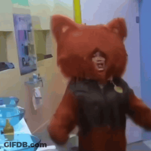 A Person In A Teddy Bear Costume Is Standing In Front Of A Bathroom Sink GIF