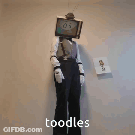 A Person In A TV Head Costume Holding A Syringe And The Word Noodles Below Them GIF