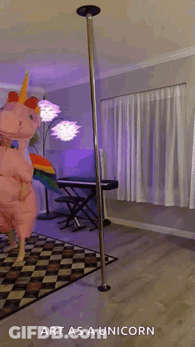 A Person In A Unicorn Costume Is Standing On A Pole . GIF