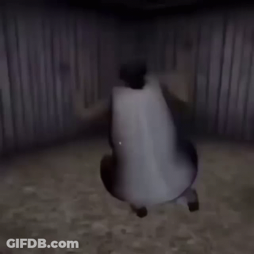 A Person In A White Dress Is Standing In Front Of A Fence . GIF
