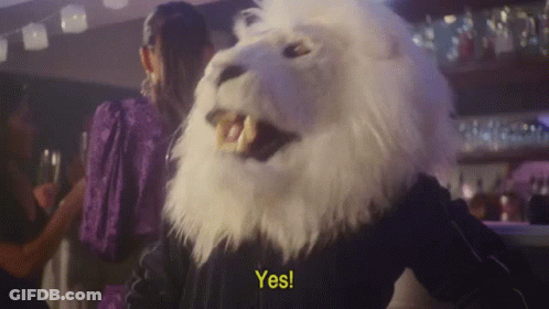 A Person In A White Lion Mask Says Yes GIF