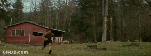 A Person In A Wolf Costume Jumping In The Air GIF