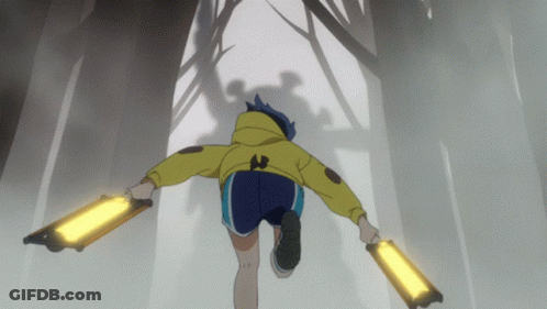 A Person In A Yellow Jacket And Blue Shorts Is Running Through A Forest GIF