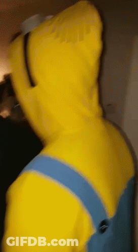 A Person In A Yellow Minion Costume With A Hood On GIF