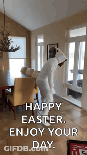 A Person In An Easter Bunny Costume Is Dancing In A Living Room With The Caption Happy Easter Enjoy Your Day GIF