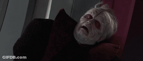 A Person Is Being Struck By A Lightning Bolt In A Dark Room . GIF