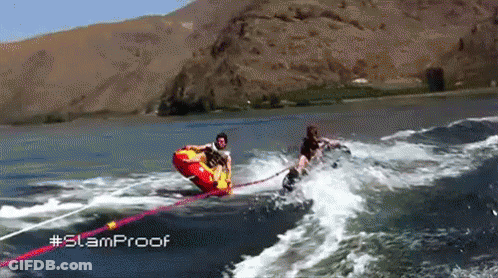 A Person Is Being Towed By A Boat In The Water With The Hashtag Slamproof GIF