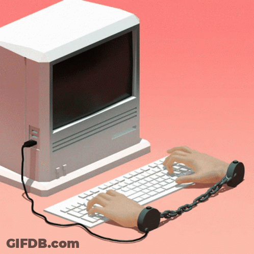 A Person Is Chained To A Keyboard With A Computer In The Background GIF