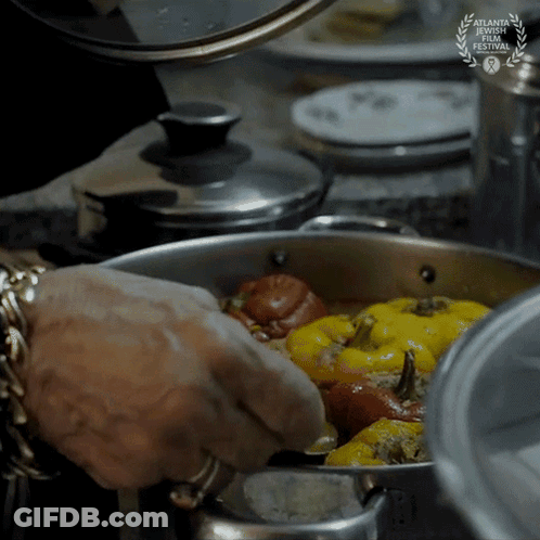 A Person Is Cooking Food In A Pot With A Laurel Wreath That Says Atlanta Documentary Film Festival GIF