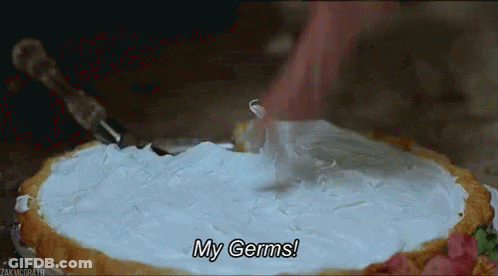 A Person Is Cutting A Pie With Whipped Cream On Top And Says `` My Germs '' . GIF