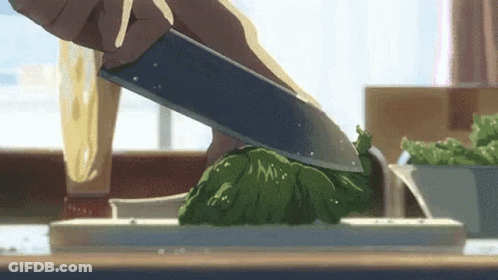 A Person Is Cutting A Piece Of Lettuce With A Knife . GIF