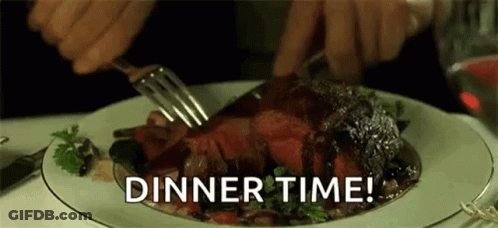 A Person Is Cutting A Piece Of Steak With A Fork And Knife On A Plate . GIF