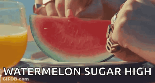 A Person Is Cutting A Slice Of Watermelon With The Words Watermelon Sugar High Below It . GIF