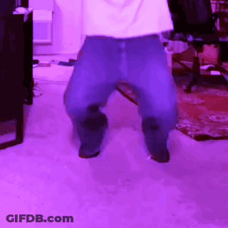 A Person Is Dancing In A Room With Purple Lighting GIF